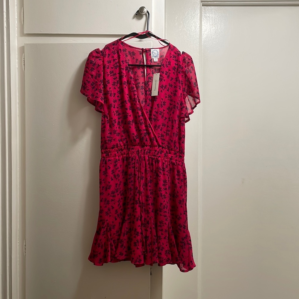 Selling Francesca’s jumpsuit. Color is Magenta with a dark blue floral pattern.